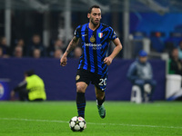 Hakan Calhanoglu of Inter Milan is in action during the Champions League match between Inter Milan and Arsenal at San Siro Stadium in Milan,...