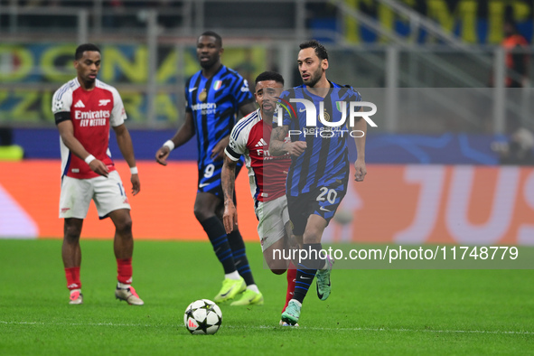 Hakan Calhanoglu of Inter Milan is in action during the Champions League match between Inter Milan and Arsenal at San Siro Stadium in Milan,...