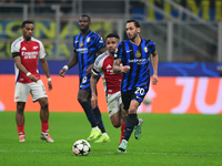 Hakan Calhanoglu of Inter Milan is in action during the Champions League match between Inter Milan and Arsenal at San Siro Stadium in Milan,...