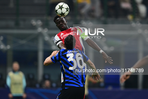 Bukayo Saka of Arsenal is in action during the Champions League match between Inter Milan and Arsenal at San Siro Stadium in Milan, Italy, o...