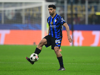 Mehdi Taremi of Inter Milan is in action during the Champions League match between Inter Milan and Arsenal at San Siro Stadium in Milan, Ita...