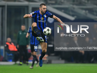 Stefan de Vrij of Inter Milan is in action during the Champions League match between Inter Milan and Arsenal at San Siro Stadium in Milan, I...