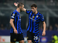 Stefan de Vrij of Inter Milan and Benjamin Savard of Inter Milan speak during the Champions League match between Inter Milan and Arsenal at...