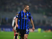 Hakan Calhanoglu of Inter Milan looks on during the Champions League match between Inter Milan and Arsenal at San Siro Stadium in Milan, Ita...