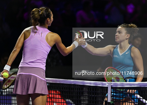 RIYADH, SAUDI ARABIA - NOVEMBER 06: Jasmine Paolini (R) of Italy congratulates Quinwen Zheng of China at the end of their match, on Day 5 of...