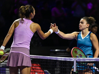 RIYADH, SAUDI ARABIA - NOVEMBER 06: Jasmine Paolini (R) of Italy congratulates Quinwen Zheng of China at the end of their match, on Day 5 of...