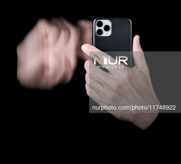 A close-up of a hand swipes on a smartphone screen, creating a motion blur effect that symbolizes the fast-paced nature of digital interacti...