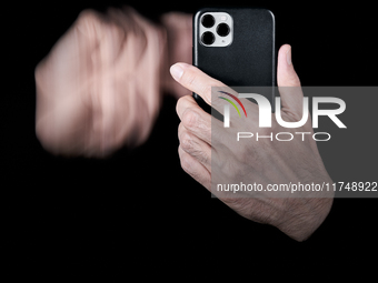 A close-up of a hand swipes on a smartphone screen, creating a motion blur effect that symbolizes the fast-paced nature of digital interacti...