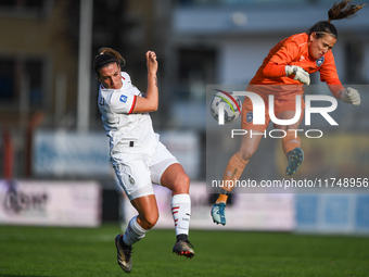 Gloria Marinelli of Milan Women competes for the ball with Maria Korenciova of Freedom Cuneo during the Women's Coppa Italia match between F...