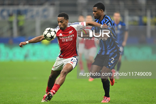 Jurrien Timber of Arsenal FC and Denzel Dumfries of FC Inter participate in the UEFA Champions League stage match Phase MD4 between Inter FC...