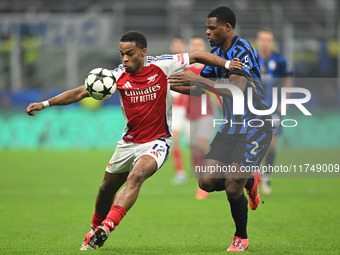 Jurrien Timber of Arsenal FC and Denzel Dumfries of FC Inter participate in the UEFA Champions League stage match Phase MD4 between Inter FC...