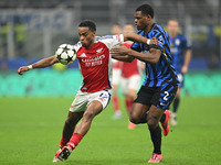 Jurrien Timber of Arsenal FC and Denzel Dumfries of FC Inter participate in the UEFA Champions League stage match Phase MD4 between Inter FC...