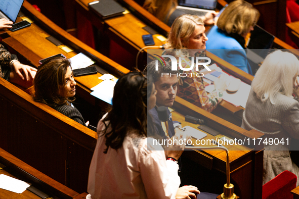 Gabriel Attal, President of the Ensemble pour la Republique parliamentary group, looks on as Prisca Thevenot, deputy of the Ensemble pour la...