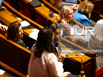 Gabriel Attal, President of the Ensemble pour la Republique parliamentary group, looks on as Prisca Thevenot, deputy of the Ensemble pour la...