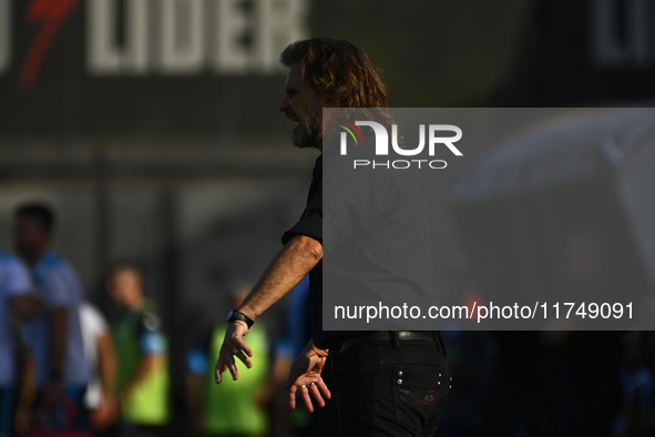 Insua, coach of Barracas Central, gives instructions to his team players during a Liga Profesional 2024 match between Barracas Central and R...