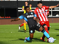 Johan Carbonero of Racing Club competes for the ball against a player from Barracas Central during a Liga Profesional 2024 match between Bar...