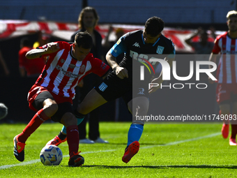 Juan Ignacio Nardoni of Racing Club competes for the ball against Facundo Mater of Barracas Central during a Liga Profesional 2024 match bet...