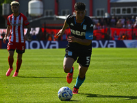 Juan Ignacio Nardoni of Racing Club drives the ball during a Liga Profesional 2024 match between Barracas Central and Racing Club at Estadio...