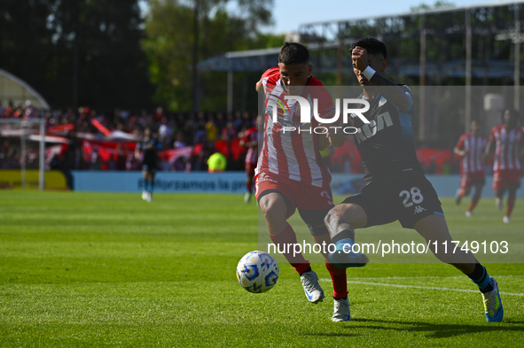 Santiago Solari of Racing Club and Facundo Mater of Barracas Central participate in a Liga Profesional 2024 match between Barracas Central a...