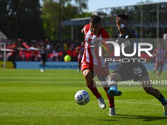 Santiago Solari of Racing Club and Facundo Mater of Barracas Central participate in a Liga Profesional 2024 match between Barracas Central a...