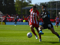 Santiago Solari of Racing Club and Facundo Mater of Barracas Central participate in a Liga Profesional 2024 match between Barracas Central a...