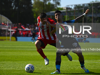 Santiago Solari of Racing Club and Facundo Mater of Barracas Central participate in a Liga Profesional 2024 match between Barracas Central a...