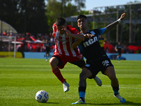 Santiago Solari of Racing Club and Facundo Mater of Barracas Central participate in a Liga Profesional 2024 match between Barracas Central a...