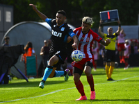 Adrian Martinez of Racing Club competes for the ball against Rodrigo Insua of Barracas Central during a Liga Profesional 2024 match between...