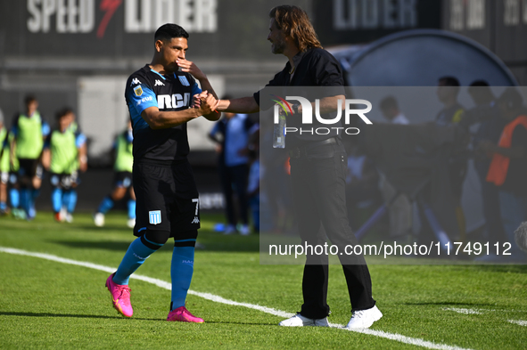 Insua, coach of Barracas Central, greets Maximiliano Salas during a Liga Profesional 2024 match between Barracas Central and Racing Club at...