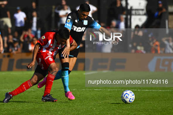 Maximiliano Salas of Racing Club competes for the ball against Maximiliano Puig of Barracas Central during a Liga Profesional 2024 match bet...