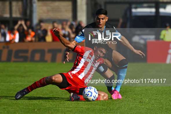 Maximiliano Salas of Racing Club competes for the ball against Maximiliano Puig of Barracas Central during a Liga Profesional 2024 match bet...