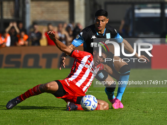 Maximiliano Salas of Racing Club competes for the ball against Maximiliano Puig of Barracas Central during a Liga Profesional 2024 match bet...