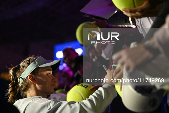 RIYADH, SAUDI ARABIA - NOVEMBER 06: Elena Rybakina of Kazakhstan signs autographs for her fans after her match against Aryna Sabalenka of Be...