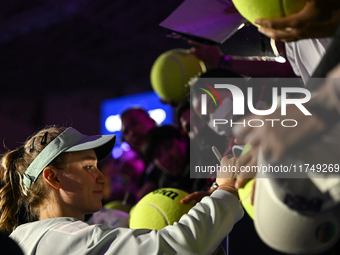 RIYADH, SAUDI ARABIA - NOVEMBER 06: Elena Rybakina of Kazakhstan signs autographs for her fans after her match against Aryna Sabalenka of Be...