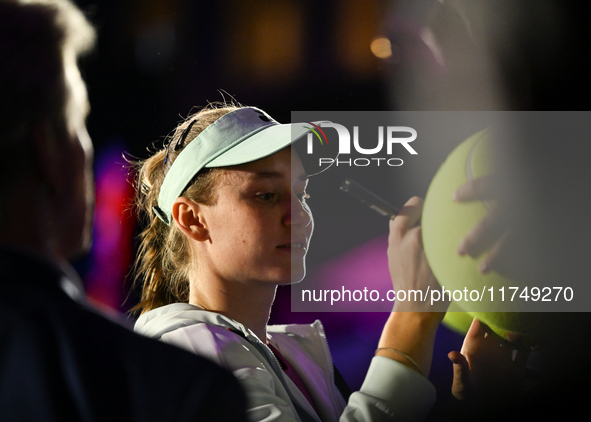 RIYADH, SAUDI ARABIA - NOVEMBER 06: Elena Rybakina of Kazakhstan signs autographs for her fans after her match against Aryna Sabalenka of Be...