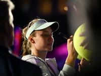 RIYADH, SAUDI ARABIA - NOVEMBER 06: Elena Rybakina of Kazakhstan signs autographs for her fans after her match against Aryna Sabalenka of Be...