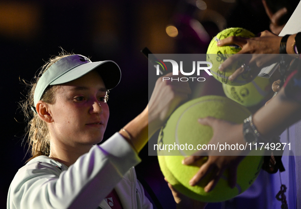 RIYADH, SAUDI ARABIA - NOVEMBER 06: Elena Rybakina of Kazakhstan signs autographs for her fans after her match against Aryna Sabalenka of Be...