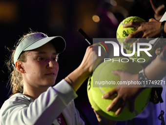 RIYADH, SAUDI ARABIA - NOVEMBER 06: Elena Rybakina of Kazakhstan signs autographs for her fans after her match against Aryna Sabalenka of Be...