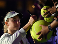 RIYADH, SAUDI ARABIA - NOVEMBER 06: Elena Rybakina of Kazakhstan signs autographs for her fans after her match against Aryna Sabalenka of Be...