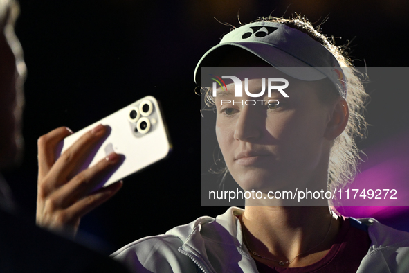 RIYADH, SAUDI ARABIA - NOVEMBER 06: Elena Rybakina of Kazakhstan takes a selfie for her fans after her match against Aryna Sabalenka of Bela...