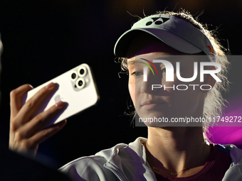 RIYADH, SAUDI ARABIA - NOVEMBER 06: Elena Rybakina of Kazakhstan takes a selfie for her fans after her match against Aryna Sabalenka of Bela...