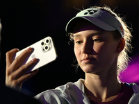 RIYADH, SAUDI ARABIA - NOVEMBER 06: Elena Rybakina of Kazakhstan takes a selfie for her fans after her match against Aryna Sabalenka of Bela...