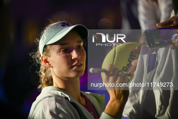 RIYADH, SAUDI ARABIA - NOVEMBER 06: Elena Rybakina of Kazakhstan signs autographs for her fans after her match against Aryna Sabalenka of Be...