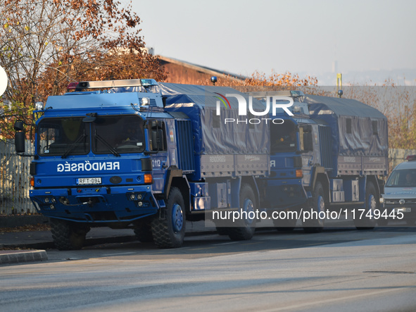 Police vehicles park outside the venue on the day of the 5th European Political Community Summit in Budapest, Hungary, on November 7, a day...