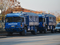 Police vehicles park outside the venue on the day of the 5th European Political Community Summit in Budapest, Hungary, on November 7, a day...