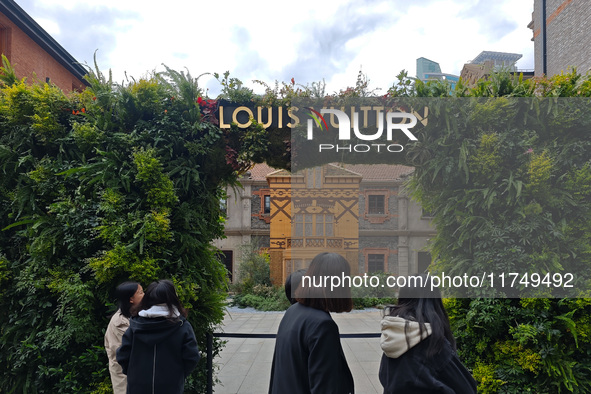 Pedestrians pass by Louis Vuitton's world's first home goods store in Shanghai, China, on November 7, 2024. 