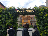 Pedestrians pass by Louis Vuitton's world's first home goods store in Shanghai, China, on November 7, 2024. (