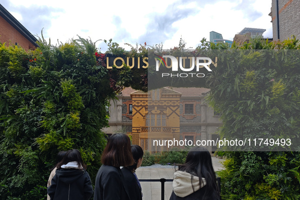 Pedestrians pass by Louis Vuitton's world's first home goods store in Shanghai, China, on November 7, 2024. 