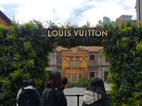 Pedestrians pass by Louis Vuitton's world's first home goods store in Shanghai, China, on November 7, 2024. (