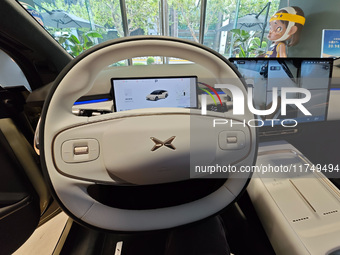 Xiaopeng's first AI car, the P7+, is displayed at its flagship store in Shanghai, China, on November 7, 2024. (